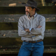 John-leaning-against-fence