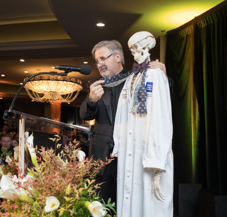 Ernie-Manouse-auctioning-off-Dr.-Hotez-lab-coat_by-Daniel-Ortiz