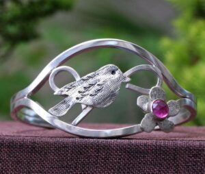 3) Ellis Cole Jewelry by Houston jeweler Robin features a sterling silver bracelet with a bird and ruby, debuting October 4 3) Ellis Cole Jewelry by Houston jeweler Robin features a sterling silver bracelet with a bird and ruby, debuting October 4