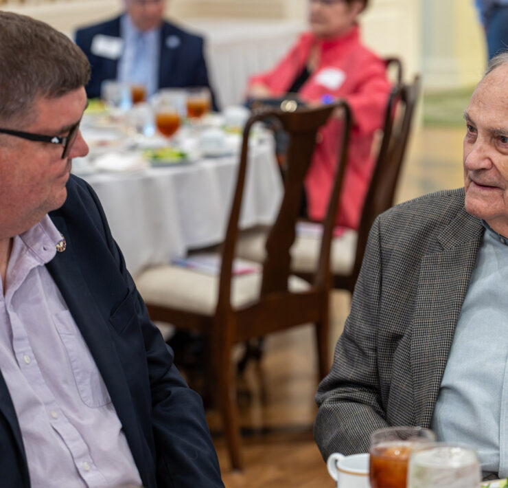 LHSAA Photo 21 Lamar’s Head Football Coach and Athletic Coordinator, Coach Mike Lindsey, talking sports with Charles Boyd, class of 1950
