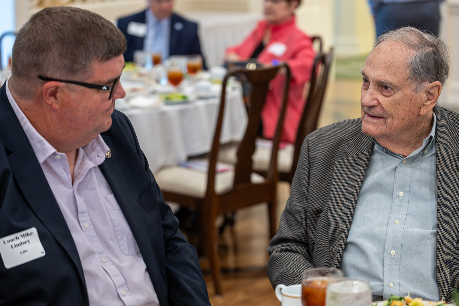 LHSAA Photo 21 Lamar’s Head Football Coach and Athletic Coordinator, Coach Mike Lindsey, talking sports with Charles Boyd, class of 1950