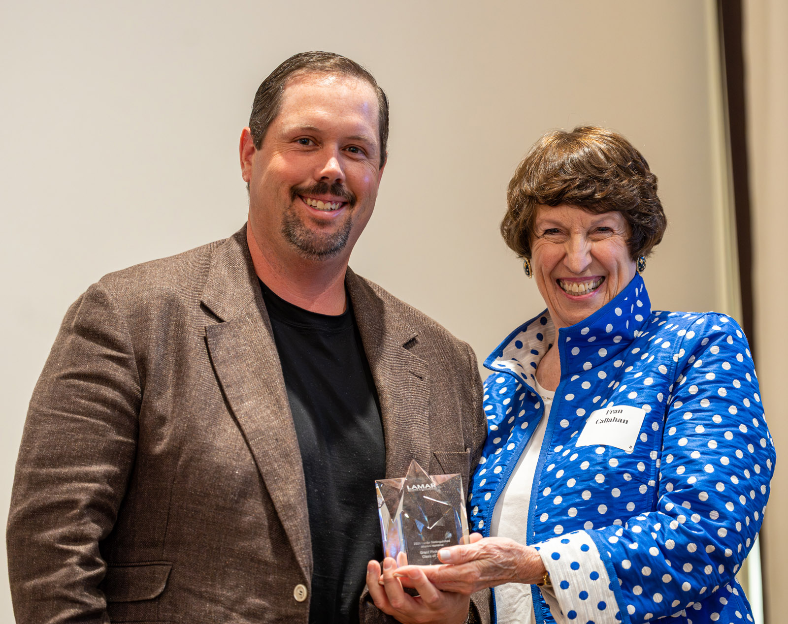LHSAA Photo 24 – (L to R) Grant Pinkerton, class of 2007, receiving his Reach for the Stars Award from the Lamar Alumni Association Founder and Board Member, Fran Callahan