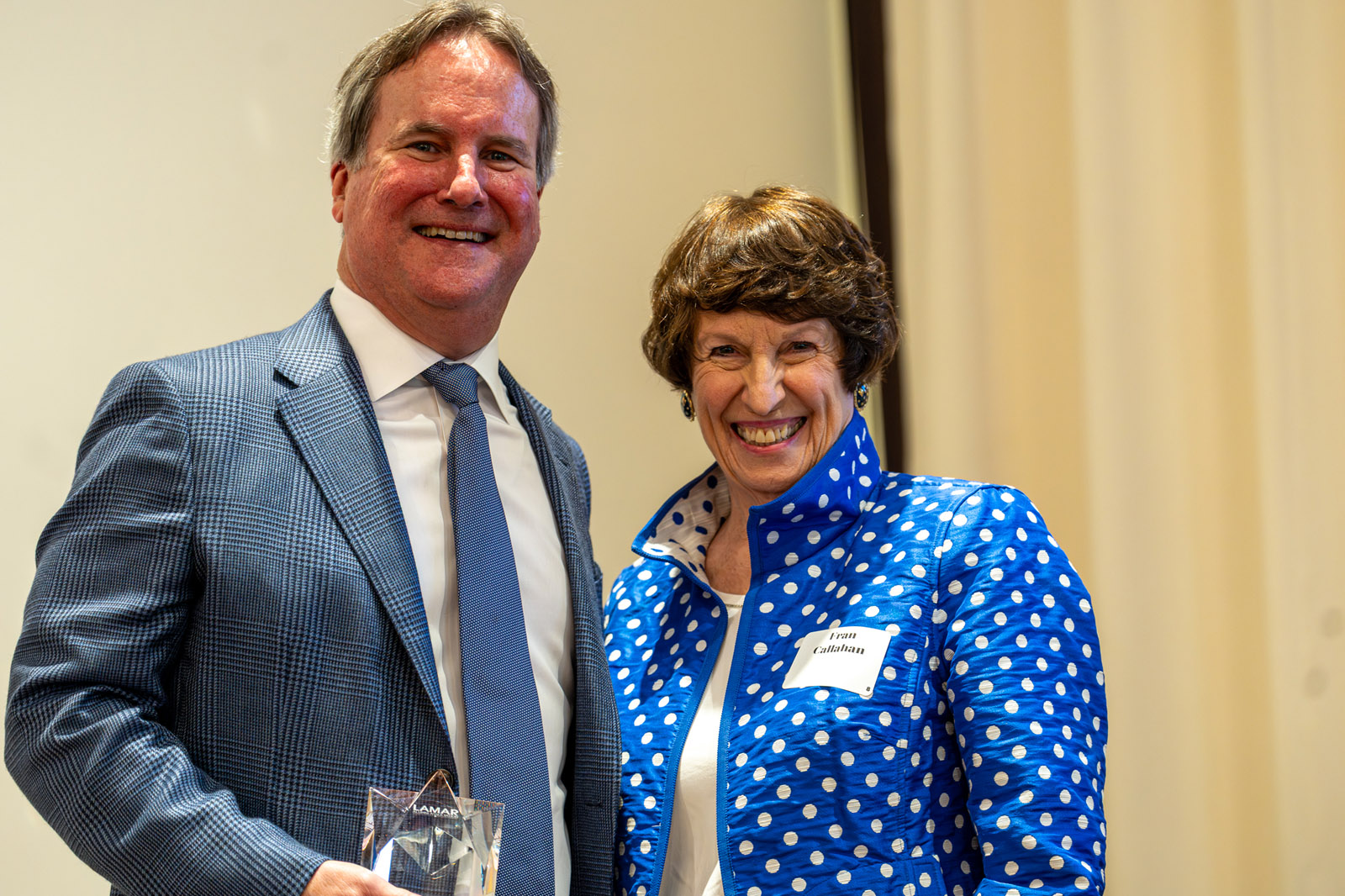 LHSAA Photo 27 (L to R) Barret Reasoner, class of 1982, receiving his Reach for the Stars Award from the Lamar Alumni Association Founder and Board Member, Fran Callahan